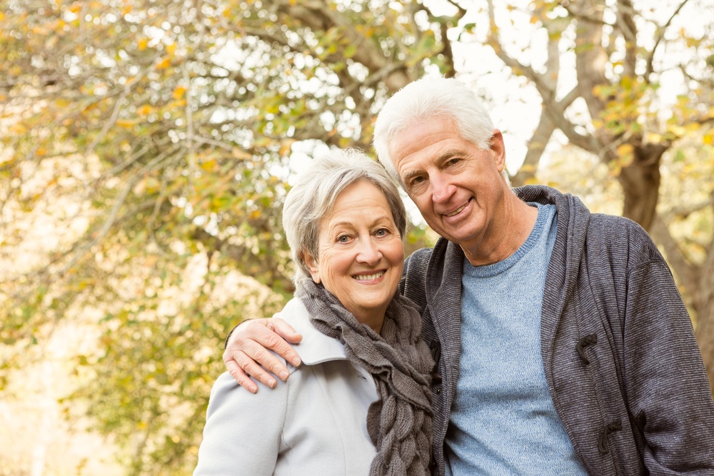 Senior couple in the park on an autumns day.jpeg